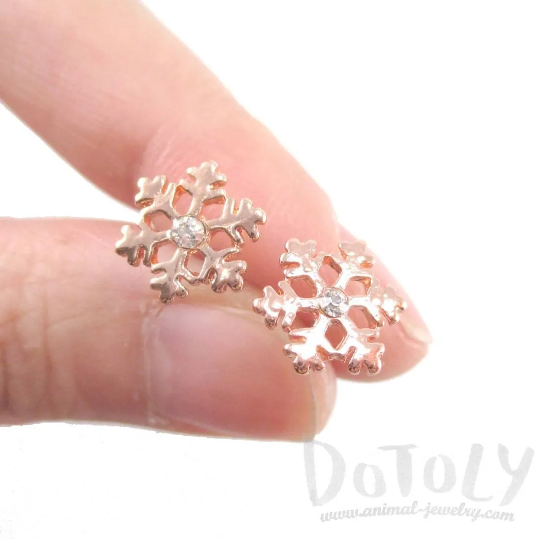 Small Snowflake Shaped Stud Earrings in Rose Gold with Rhinestones | DOTOLY