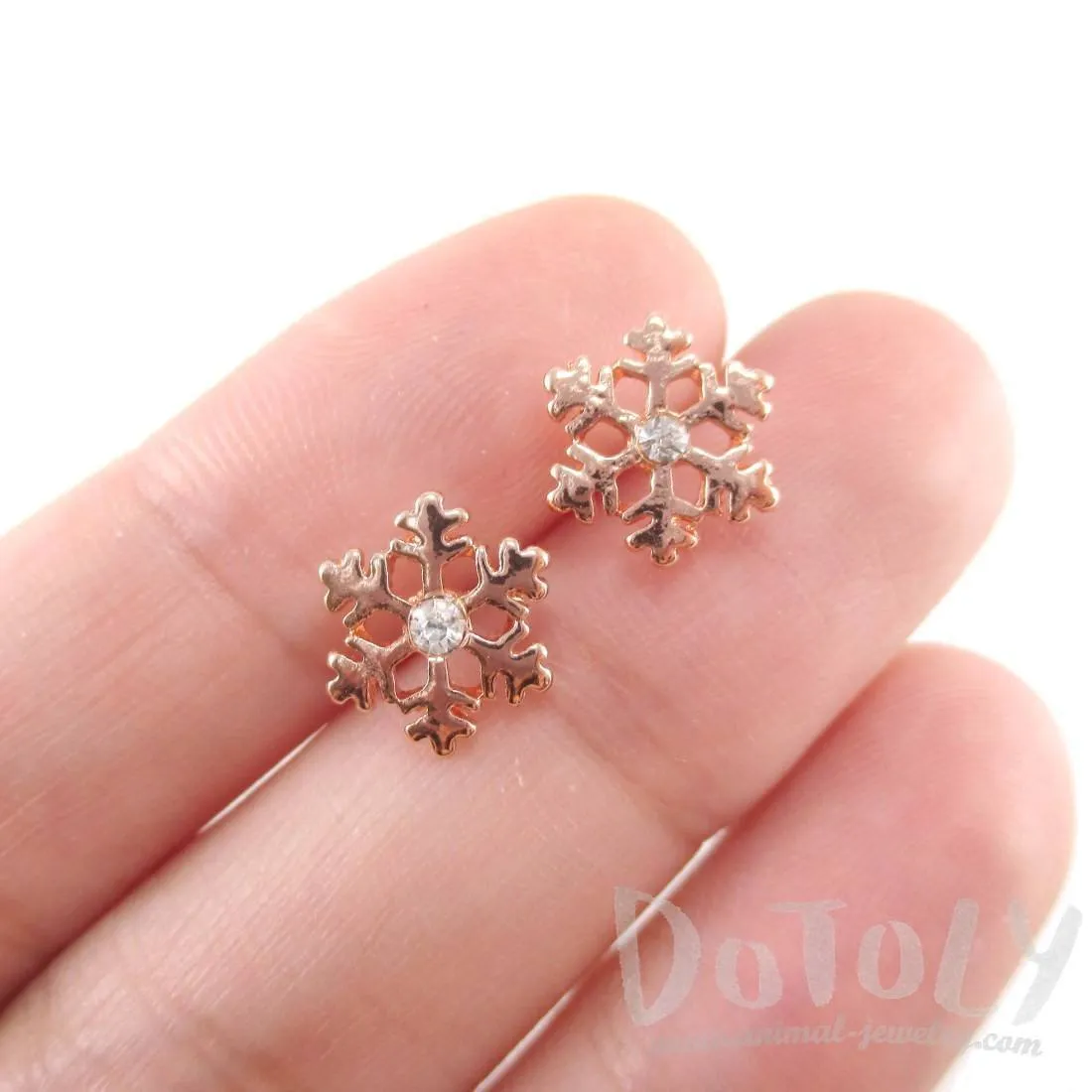 Small Snowflake Shaped Stud Earrings in Rose Gold with Rhinestones | DOTOLY